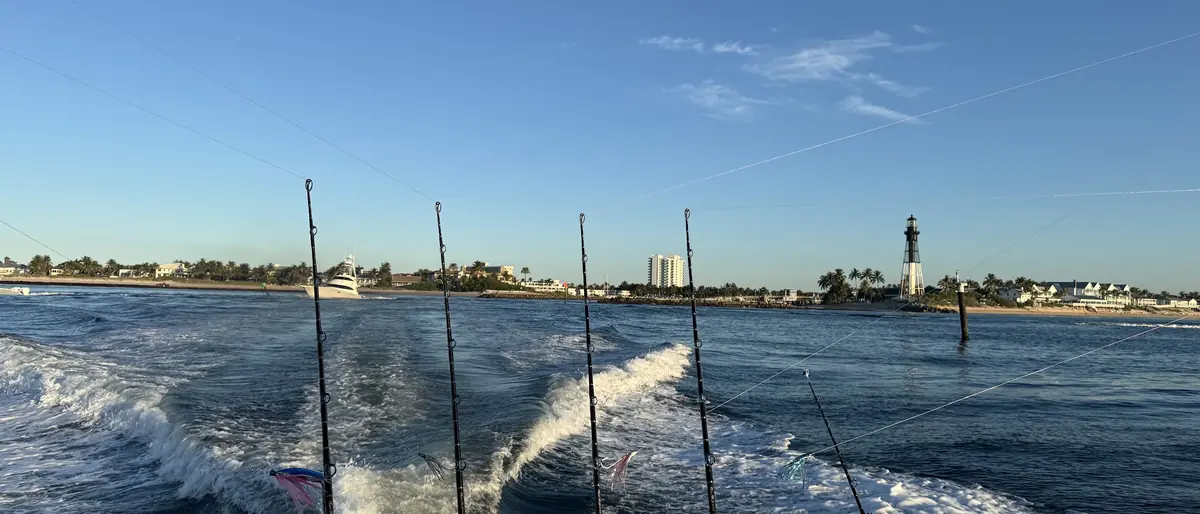The Gradyful boat running out of Hillsboro Inlet at first light with rods in the holders